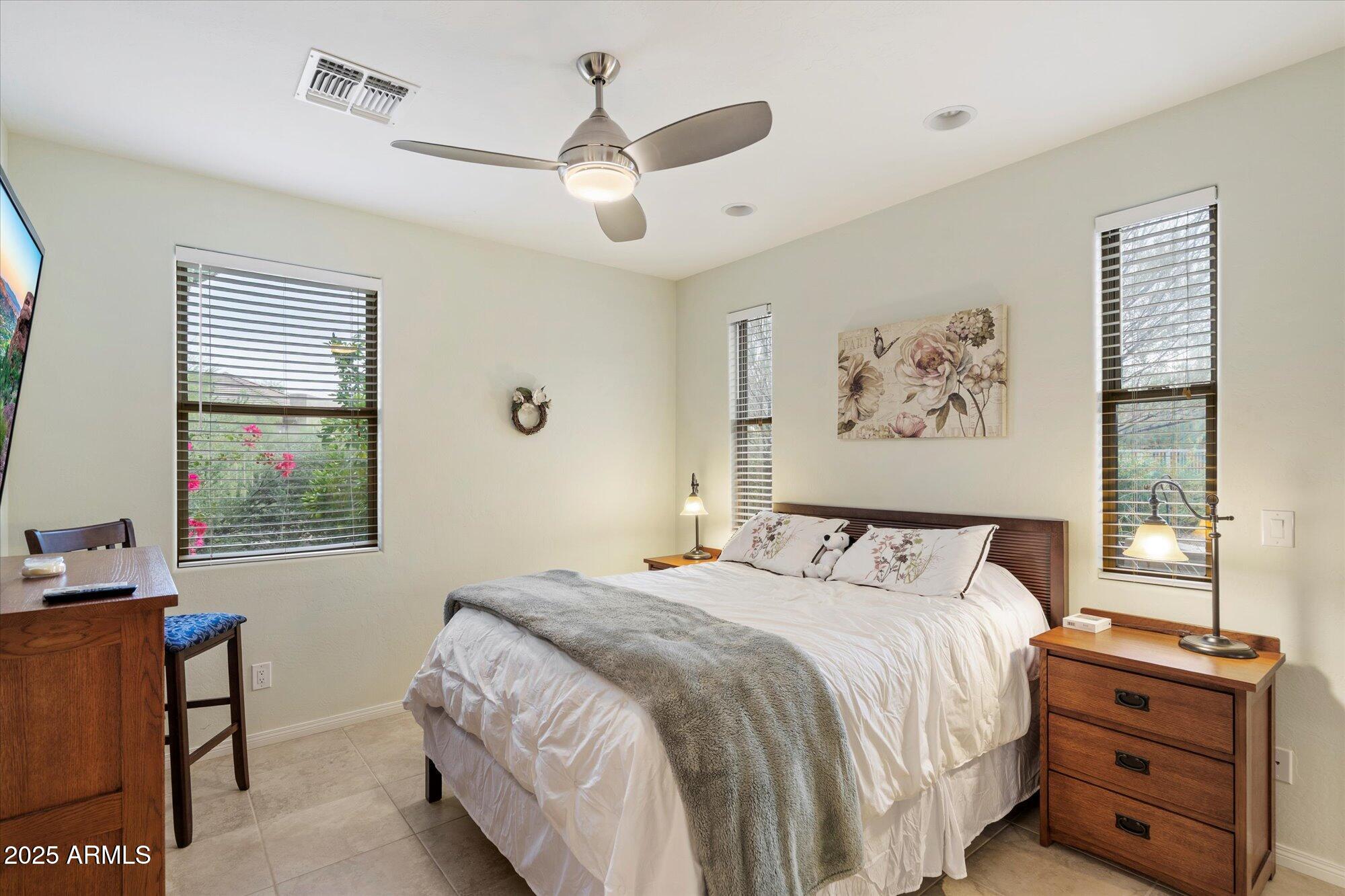 6867 East Crimson Sky Trail Scottsdale, AZ 85266 - Photo 51 of 97 a bedroom with a large bed and a window