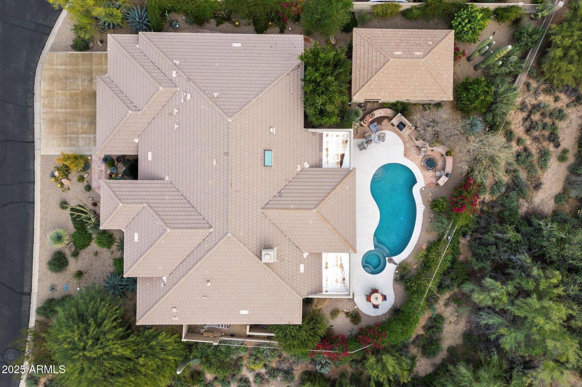 6867 East Crimson Sky Trail Scottsdale, AZ 85266 - Photo 7 of 97 an aerial view of a house with a swimming pool and a yard