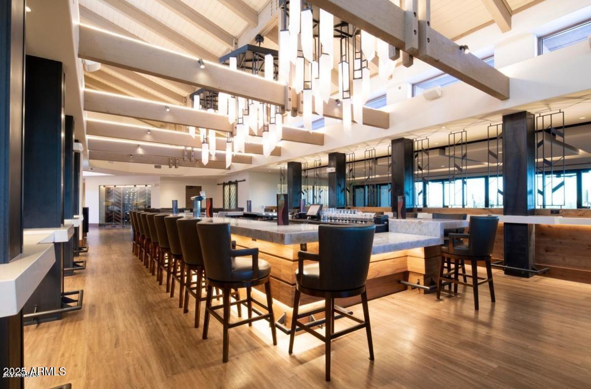 6867 East Crimson Sky Trail Scottsdale, AZ 85266 - Photo 72 of 97 a view of a dining room with furniture window and wooden floor