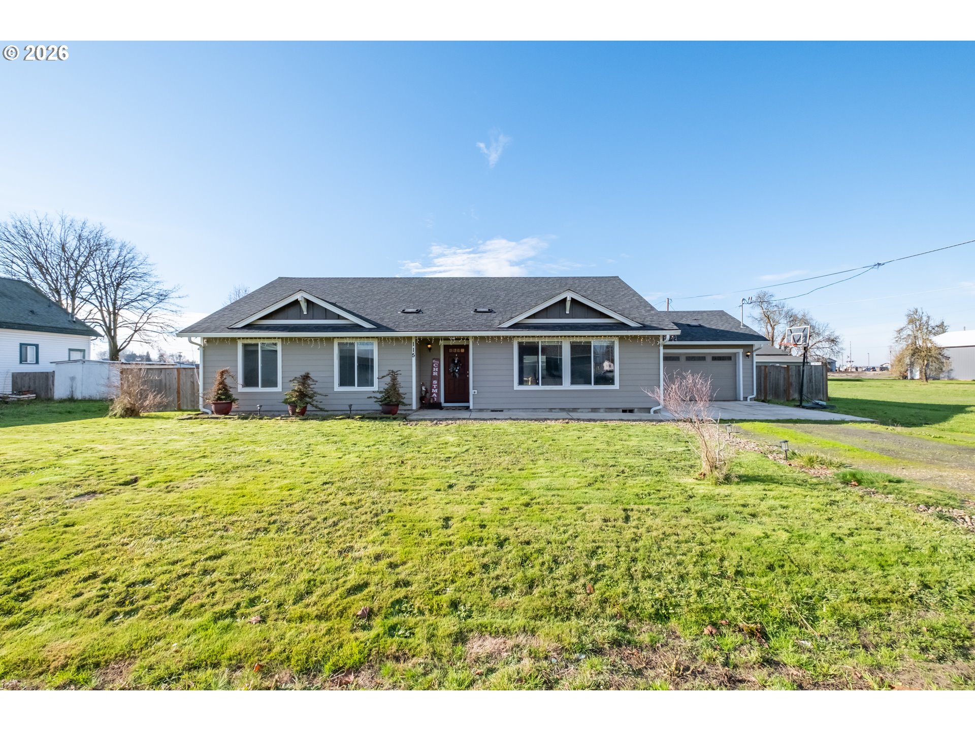 a front view of house with yard and swimming pool