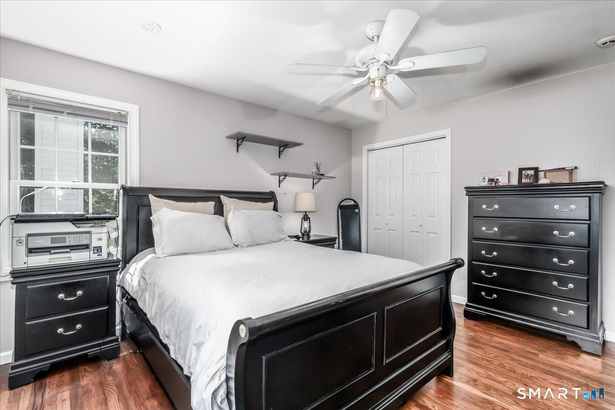 55 A Flax Hill Road Brookfield, CT 06804 - Photo 25 of 40 a bedroom with a bed and a ceiling fan
