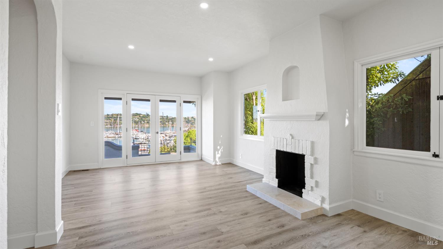 833 Bridgeway, Unit 5 Sausalito, CA 94965 - Photo 11 of 26 a view of an empty room with wooden floor and a window