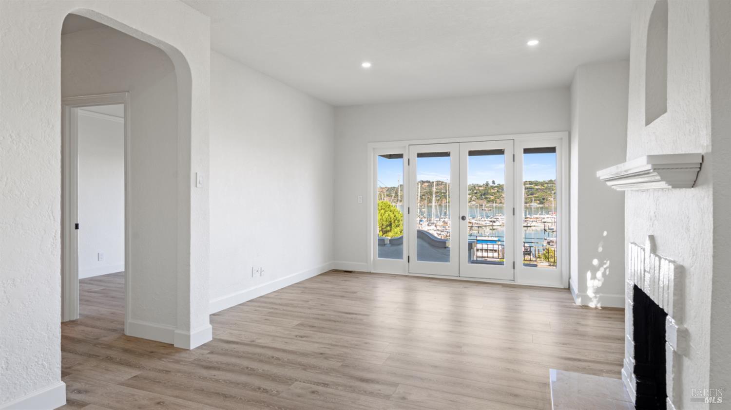 833 Bridgeway, Unit 5 Sausalito, CA 94965 - Photo 12 of 26 a view of an empty room with wooden floor and a window