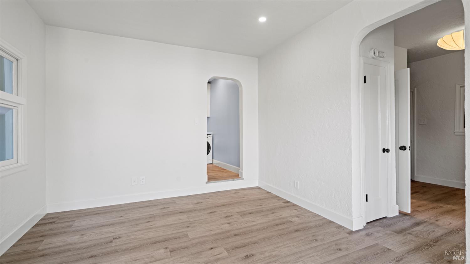833 Bridgeway, Unit 5 Sausalito, CA 94965 - Photo 15 of 26 a view of an empty room with wooden floor and a bathroom