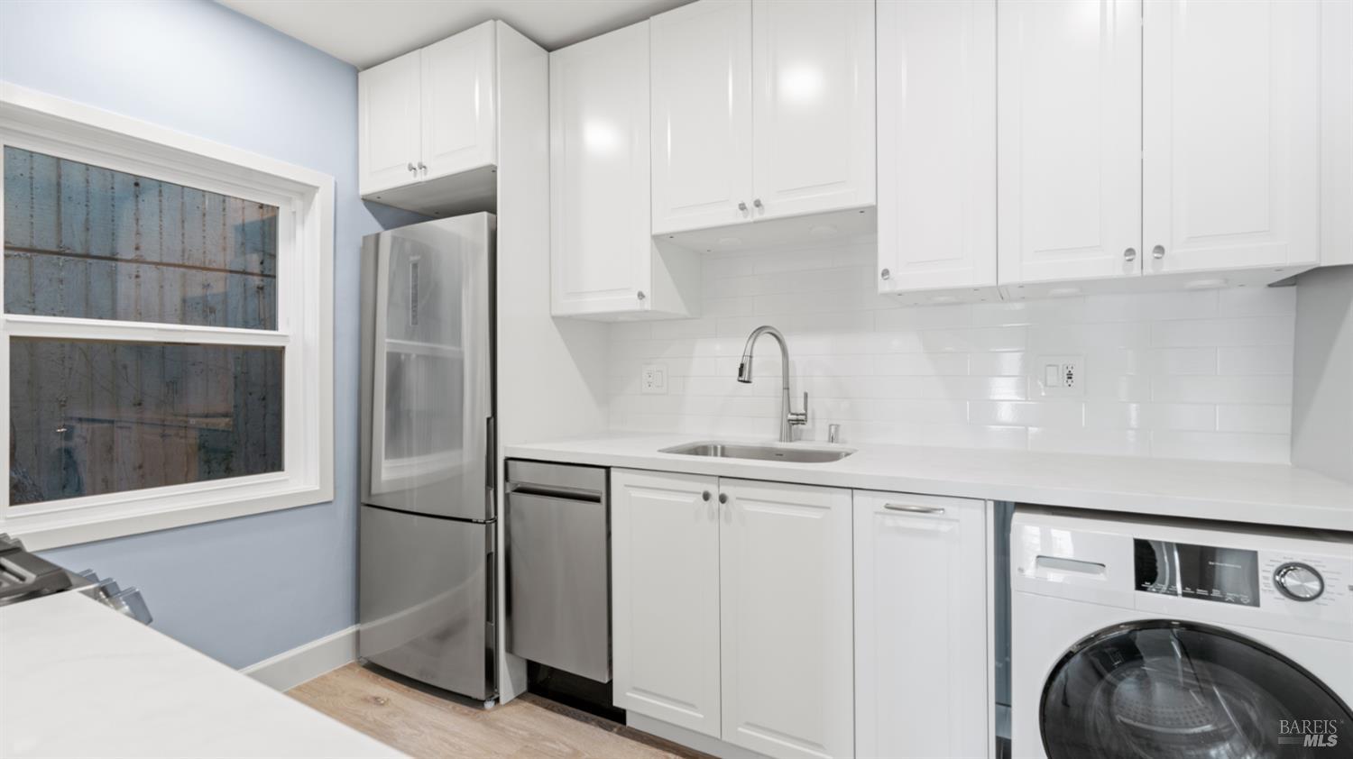 833 Bridgeway, Unit 5 Sausalito, CA 94965 - Photo 18 of 26 a kitchen with cabinets and window
