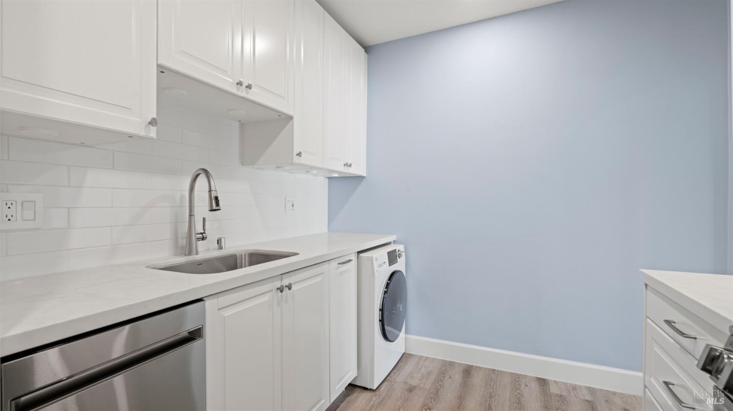 833 Bridgeway, Unit 5 Sausalito, CA 94965 - Photo 20 of 26 a kitchen with a sink and cabinets
