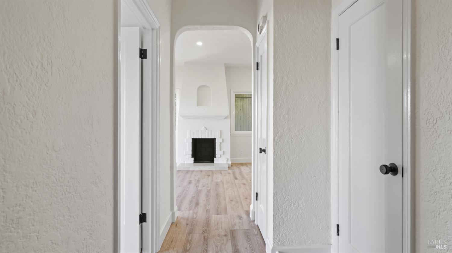 833 Bridgeway, Unit 5 Sausalito, CA 94965 - Photo 4 of 26 a view of a hallway with wooden floor