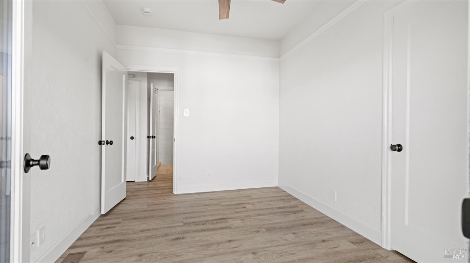 833 Bridgeway, Unit 5 Sausalito, CA 94965 - Photo 9 of 26 a view of a hallway with wooden floor