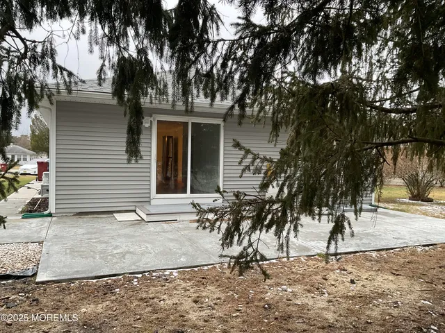 a view of a backyard of the house