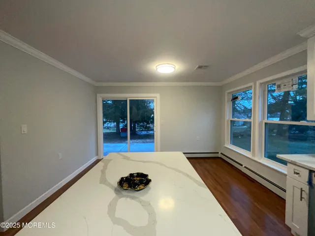 a view of a room with window and tub