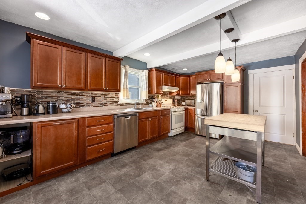 28 Ellsworth Street Medford, MA 02155 - Photo 1 of 23 a kitchen with sink cabinets and window