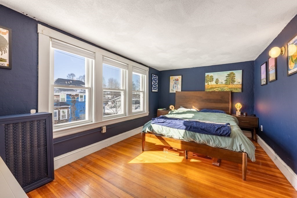 28 Ellsworth Street Medford, MA 02155 - Photo 11 of 23 a bedroom with furniture and a large window