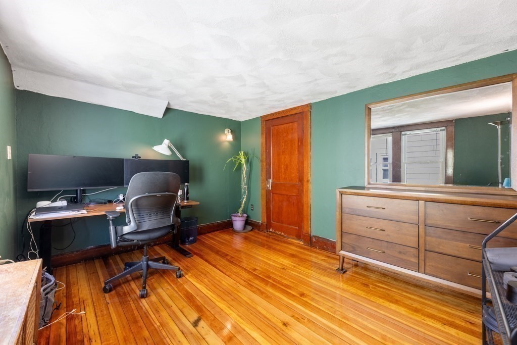 28 Ellsworth Street Medford, MA 02155 - Photo 13 of 23 a room with cabinets and wooden floor