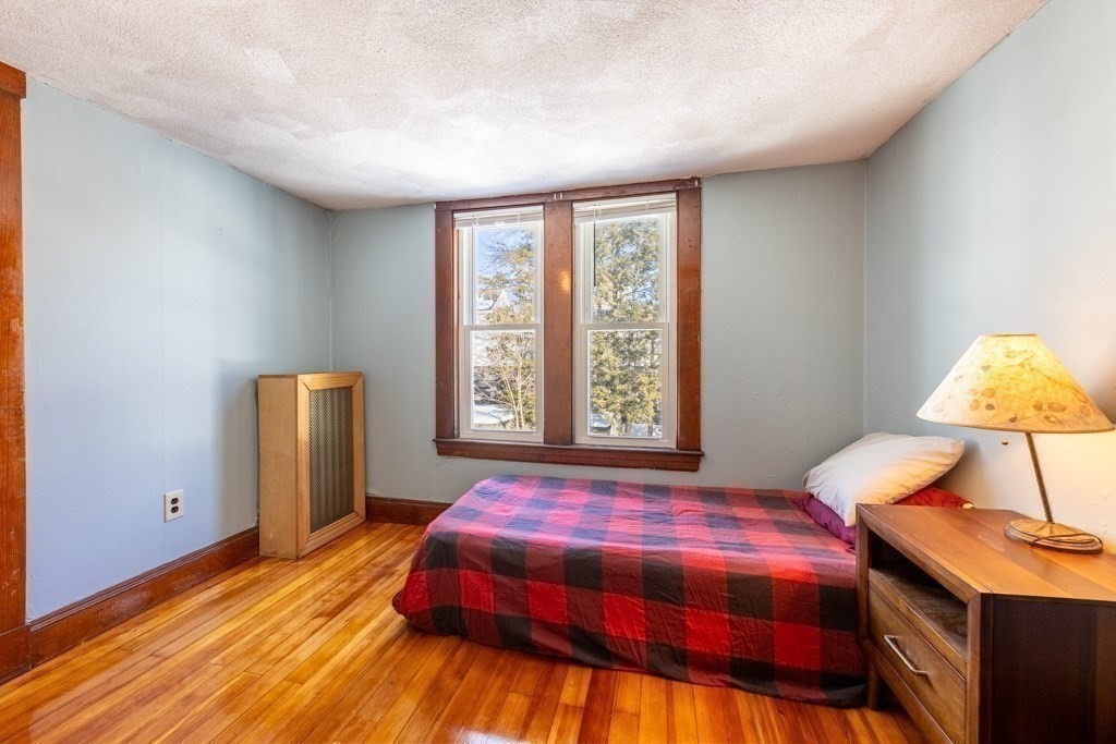 28 Ellsworth Street Medford, MA 02155 - Photo 14 of 23 a bedroom with a bed and a window