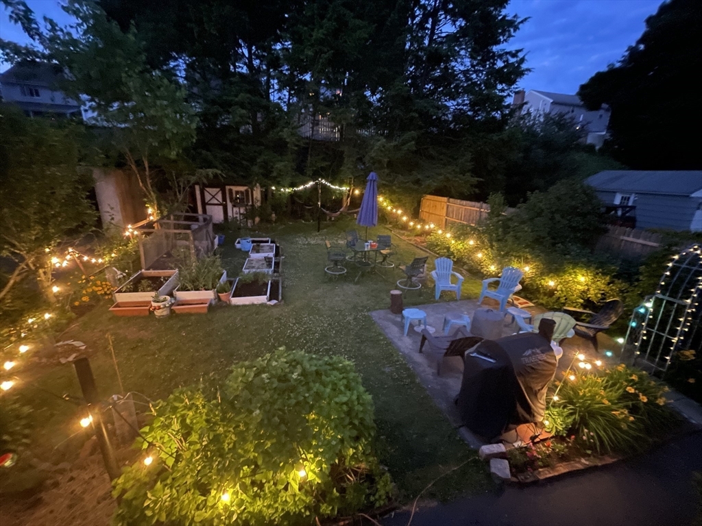 28 Ellsworth Street Medford, MA 02155 - Photo 18 of 23 a view of a backyard with plants and a patio
