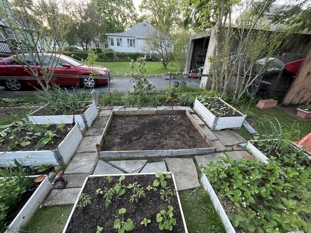 28 Ellsworth Street Medford, MA 02155 - Photo 20 of 23 a view of yard with car parked car