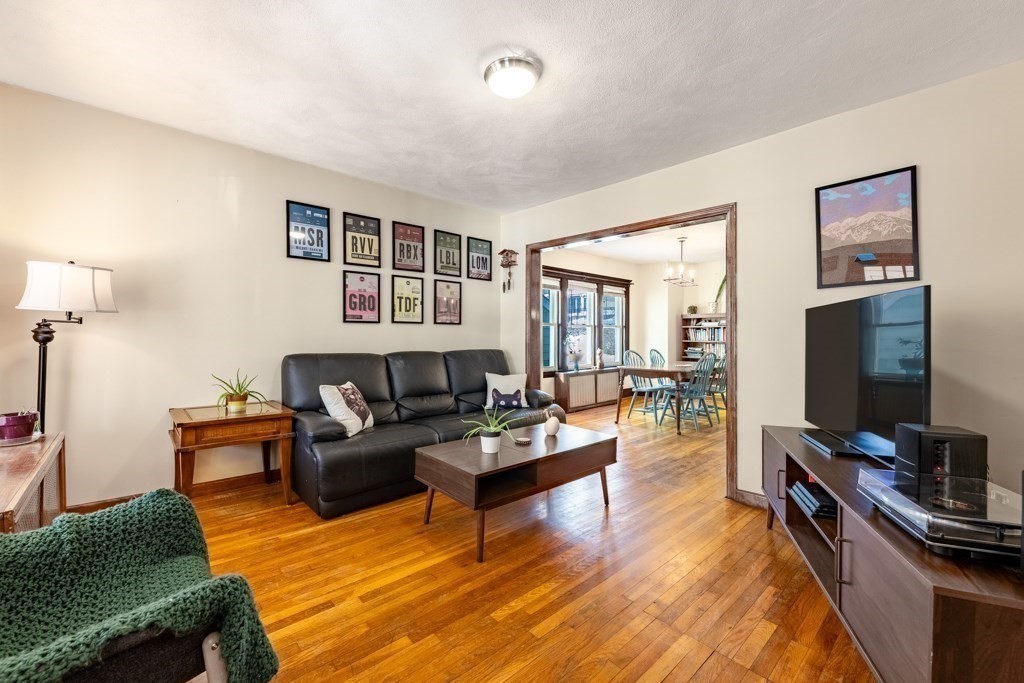 28 Ellsworth Street Medford, MA 02155 - Photo 7 of 23 a living room with furniture and a flat screen tv