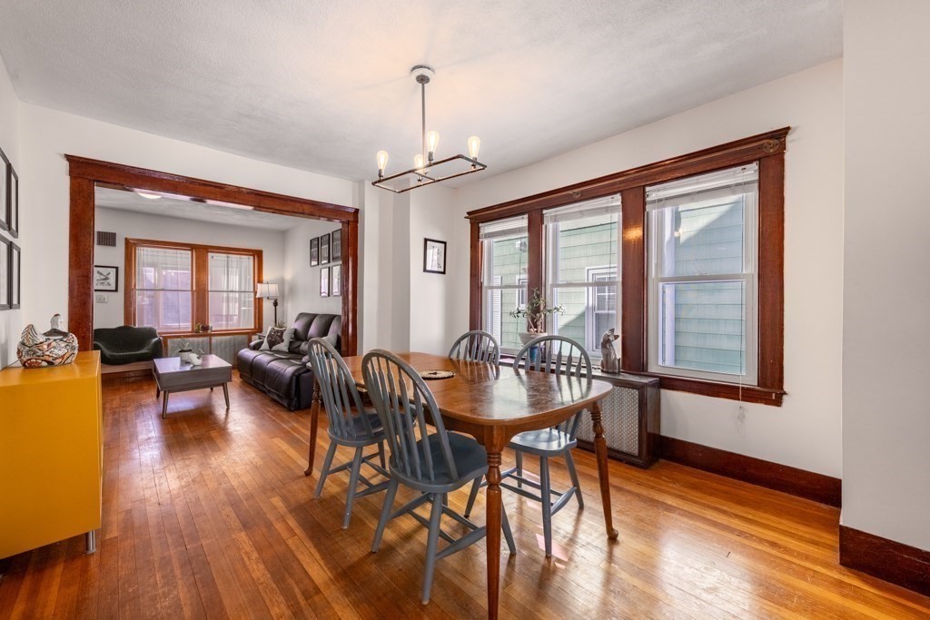 28 Ellsworth Street Medford, MA 02155 - Photo 8 of 23 a view of a dining room with furniture window and wooden floor