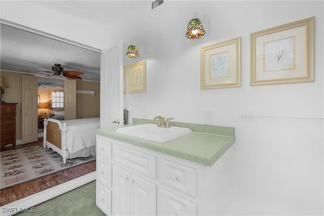 a view of bathroom with dual sinks