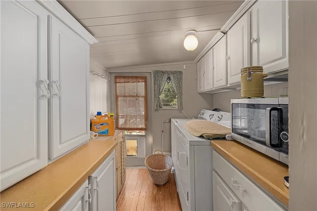 a kitchen with stainless steel appliances a stove a sink and a refrigerator