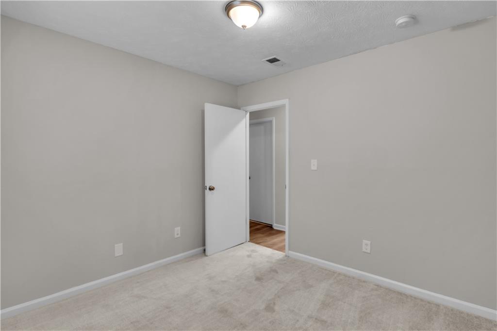 5796 Bobbin Lane Lithonia, GA 30058 - Photo 14 of 17 a view of an empty room