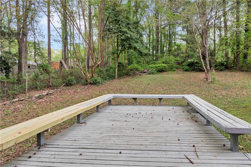 5796 Bobbin Lane Lithonia, GA 30058 - Photo 15 of 17 a view of a backyard with trees