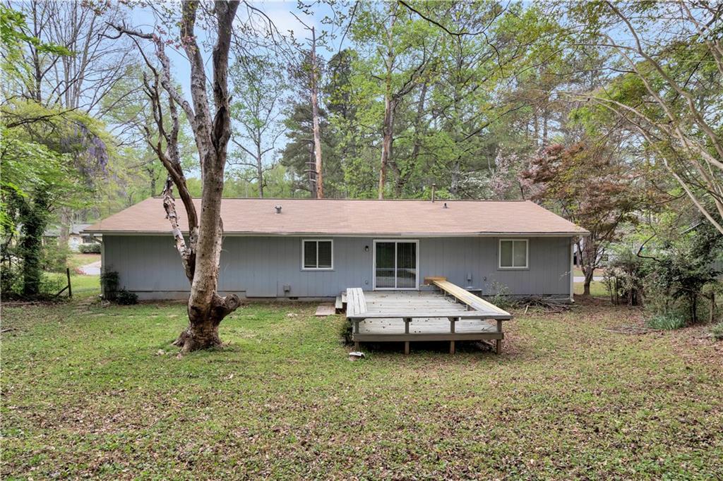 5796 Bobbin Lane Lithonia, GA 30058 - Photo 16 of 17 a house that has a tree in front of it