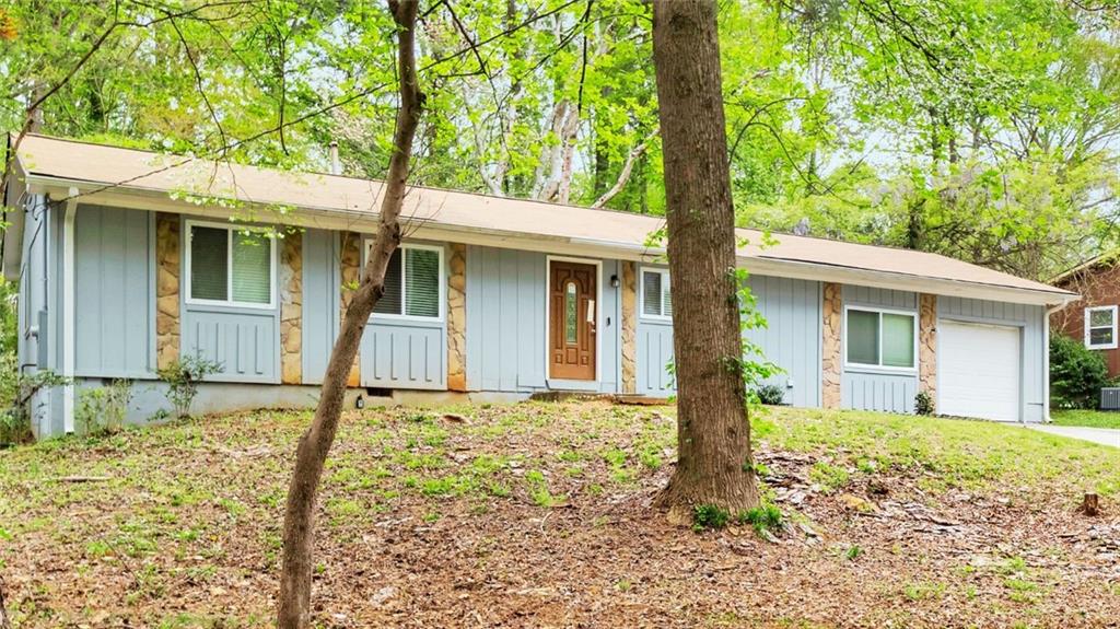 5796 Bobbin Lane Lithonia, GA 30058 - Photo 2 of 17 a front view of a house with garden