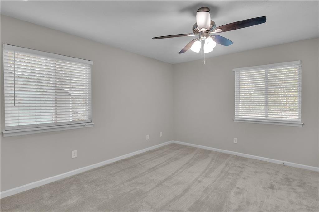5796 Bobbin Lane Lithonia, GA 30058 - Photo 9 of 17 a very nice looking room with a window and a chandelier fan