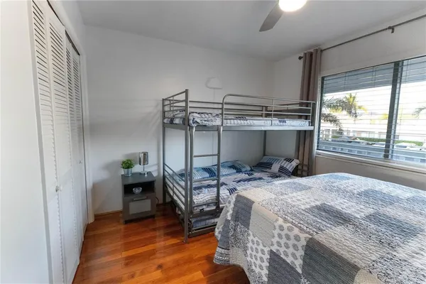 a bed room with a bed and a window