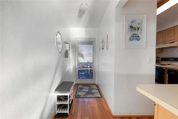 walk in closet with wooden floor