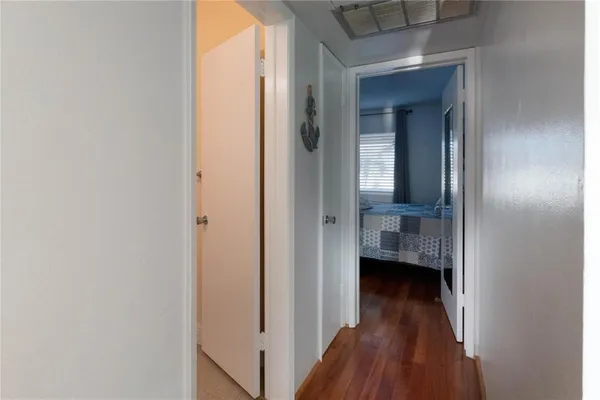 a view of a bathroom from a hallway