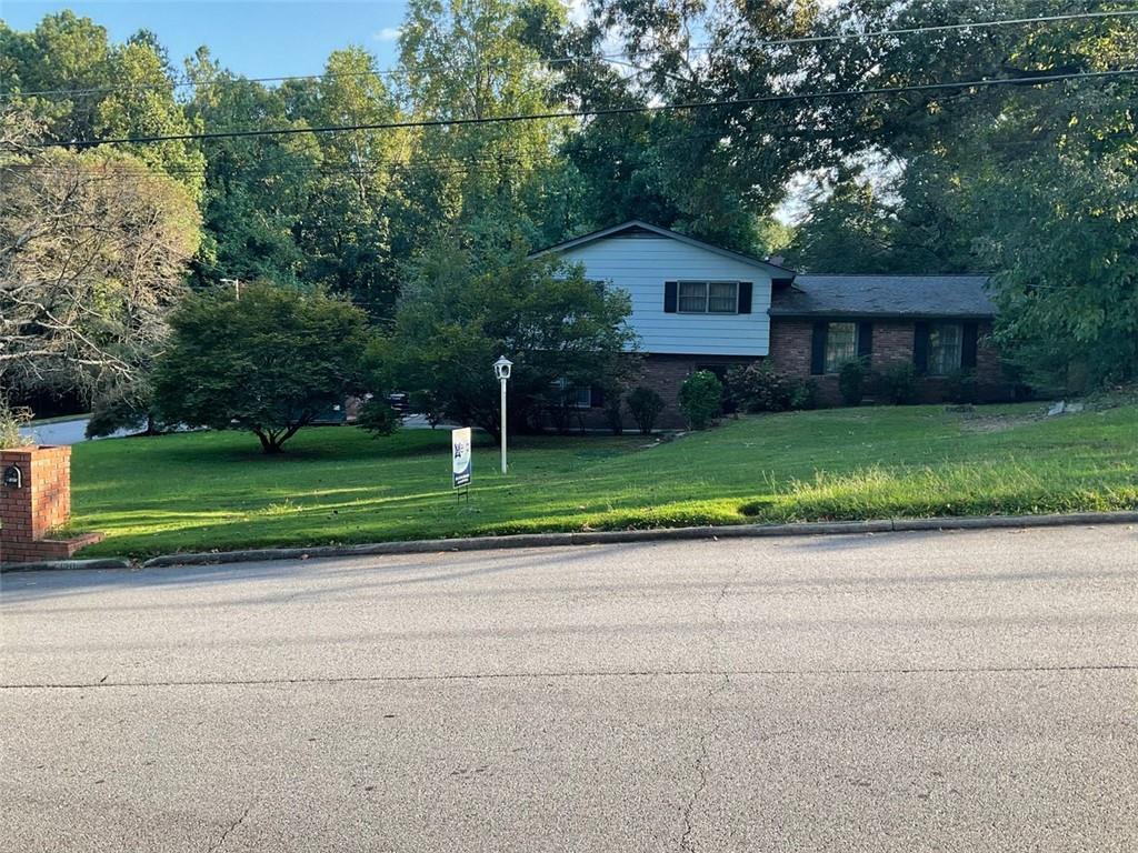 5130 Erin Road Southwest Atlanta, GA 30331 - Photo 1 of 1 a house view with a sitting space and garden