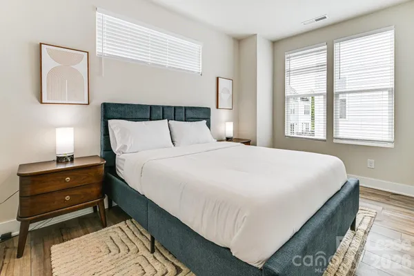 a bedroom with bed and window