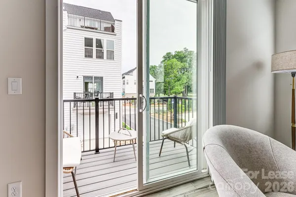 a balcony view with a glass door