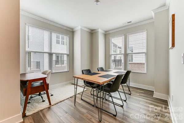 a dining room with wooden floor and wooden floor