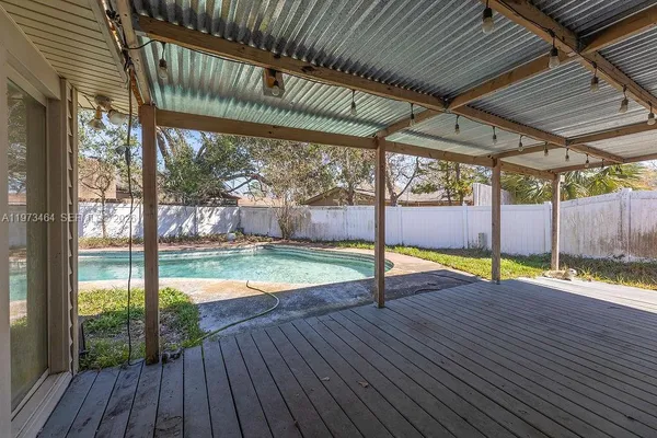 a view of a swimming pool with a porch