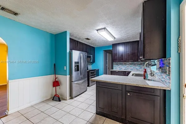 a bathroom with a sink tub and a mirror