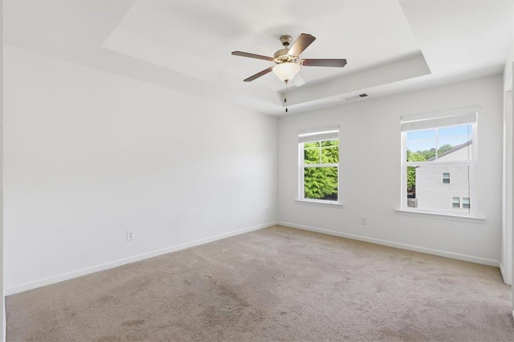 5064 Longview Walk Decatur, GA 30035 - Photo 22 of 30 an empty room with windows and fan