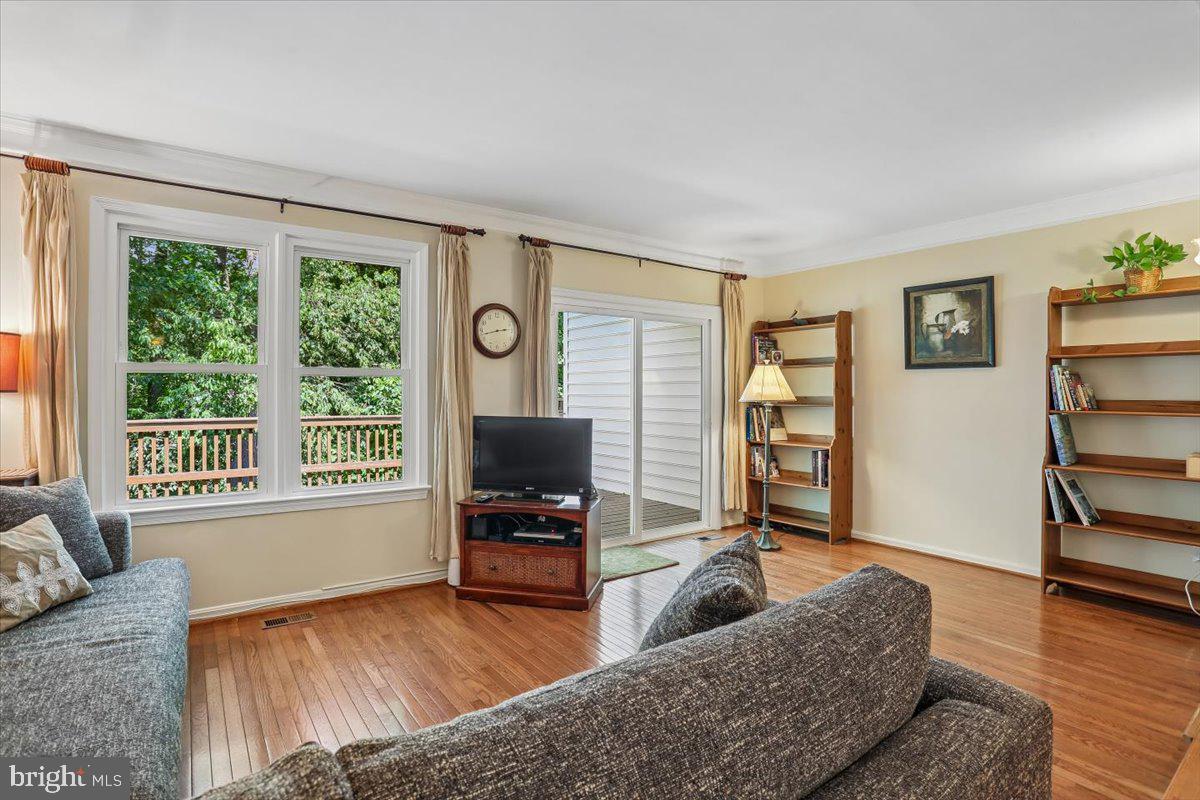 2459 McCormick Road Rockville, MD 20850 - Photo 16 of 54 Sunny Living Room opening to Rear Deck
