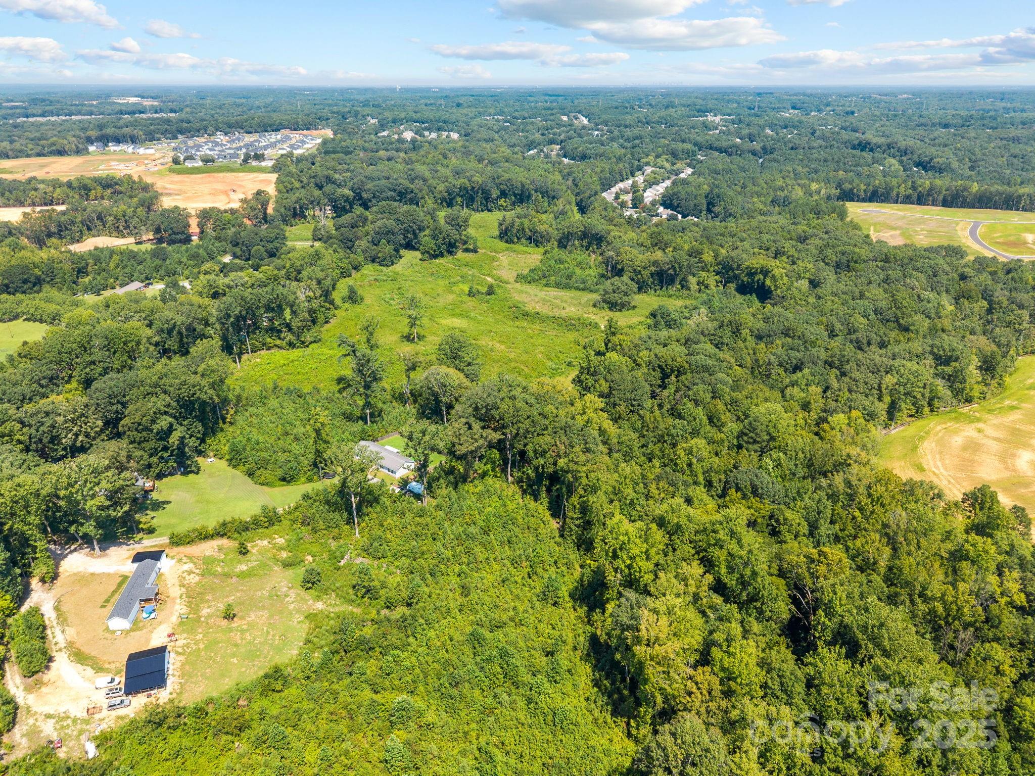 8188 Henry Harris Road, Unit 2 Fort Mill, SC 29707 - Photo 19 of 25 a view of a lake with houses