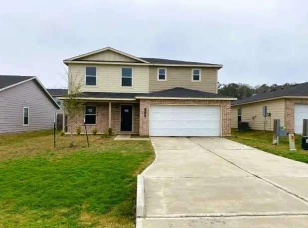 a front view of a house with a garden and porch