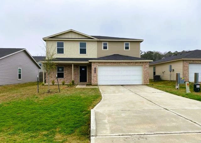 15532 Taylorcrest Drive Conroe, TX 77306 - Photo 2 of 36 a front view of house with yard