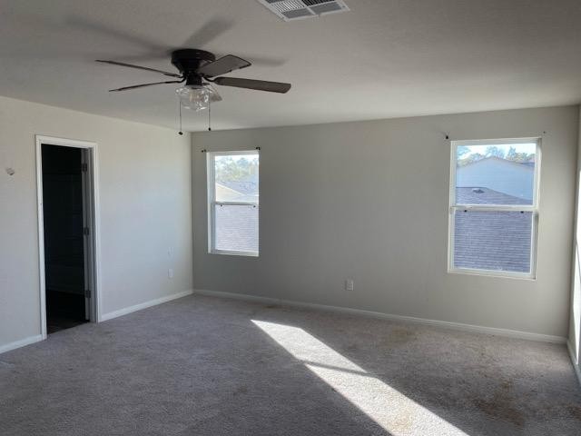 15532 Taylorcrest Drive Conroe, TX 77306 - Photo 27 of 36 an empty room with a window and a fan