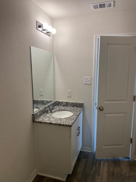 15532 Taylorcrest Drive Conroe, TX 77306 - Photo 33 of 36 a bathroom with a granite countertop sink and a mirror
