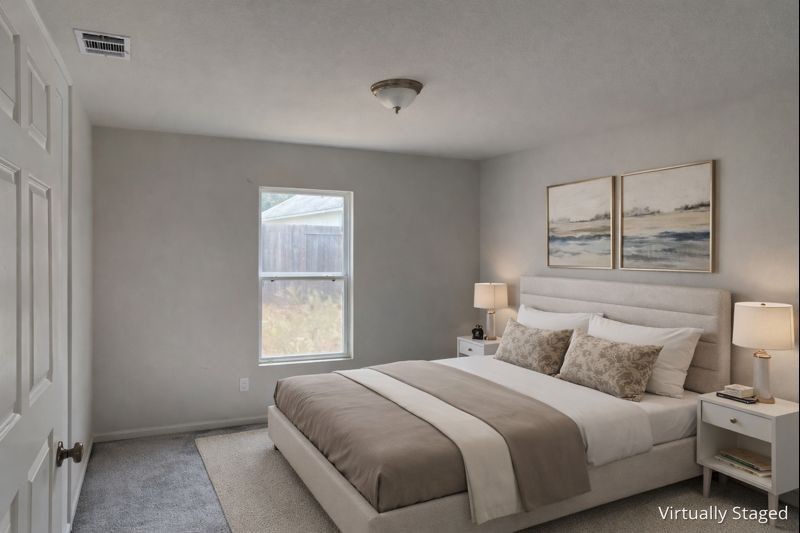 15532 Taylorcrest Drive Conroe, TX 77306 - Photo 5 of 36 a bedroom with a bed and a window