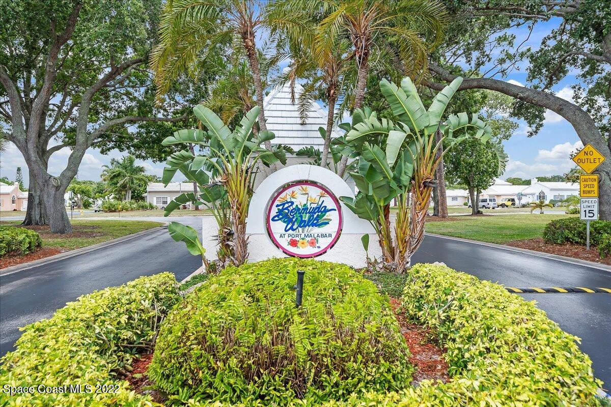 1965 Sundew Court Northeast Palm Bay, FL 32905 - Photo 1 of 29 a front view of a house with garden