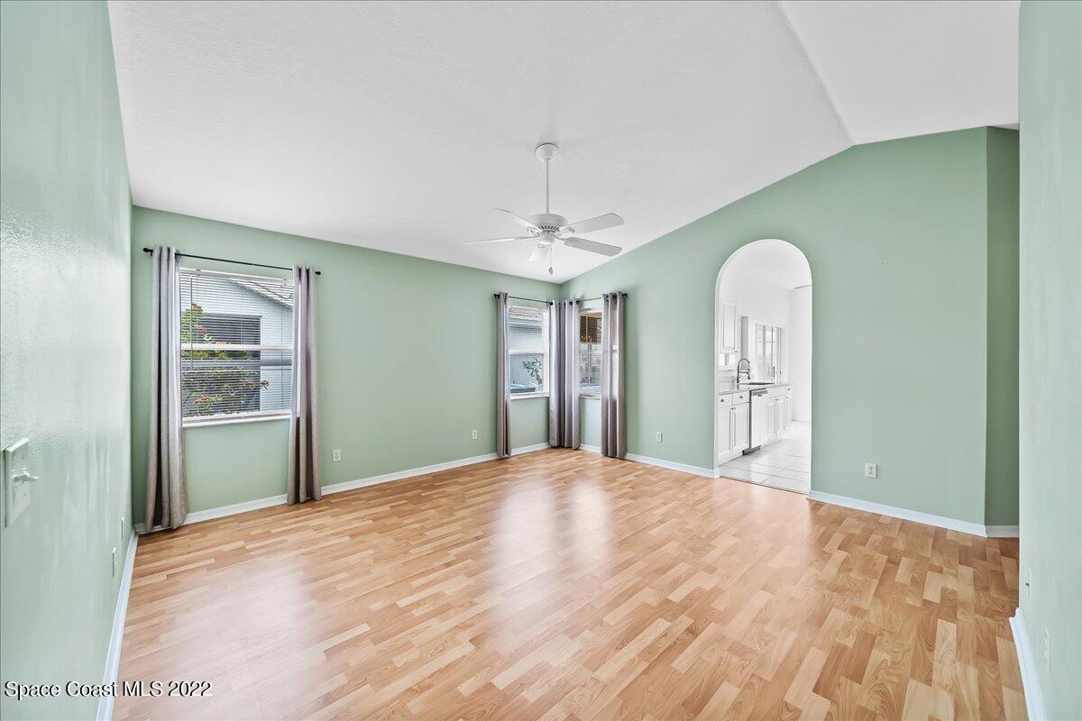 1965 Sundew Court Northeast Palm Bay, FL 32905 - Photo 20 of 29 a big room with windows and cabinet