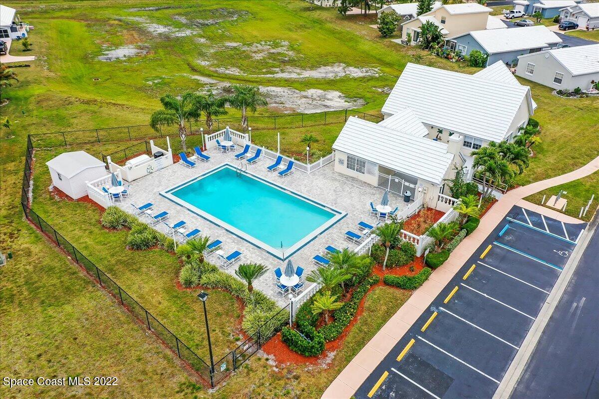 1965 Sundew Court Northeast Palm Bay, FL 32905 - Photo 2 of 29 an aerial view of a pool patio swimming pool and outdoor seating