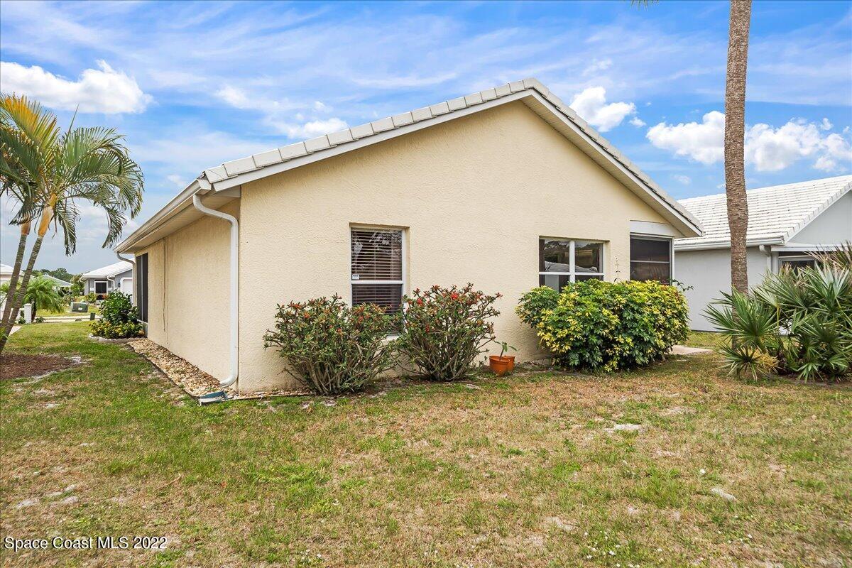 1965 Sundew Court Northeast Palm Bay, FL 32905 - Photo 26 of 29 a view of a house with backyard and garden
